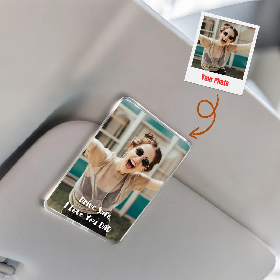 Personalized photo card with a printed photo of a person and text on a white surface.