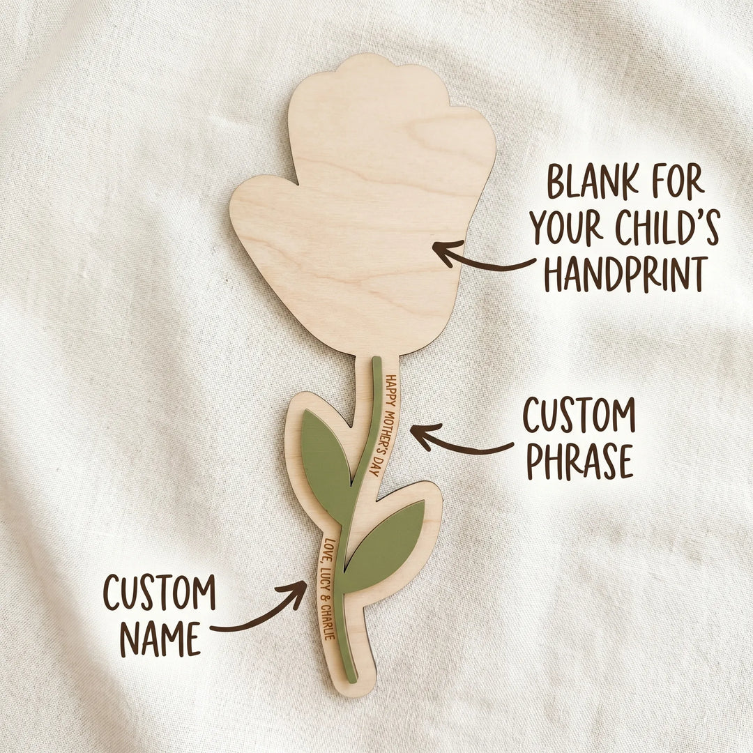 Personalized Mother's Day handprint flower sign showing customization options: blank handprint area, custom phrase, and custom name laser engraved on maple wood and acrylic